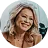 Smiling blonde woman in a circular testimonial portrait